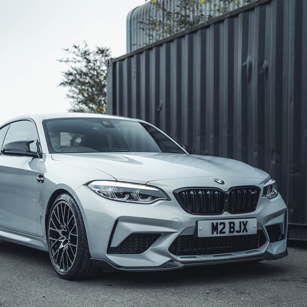 BMW M2C F87 carbon fibre splitter by CT Carbon, V4 style, featuring sleek carbon fiber design and aerodynamic splitters.