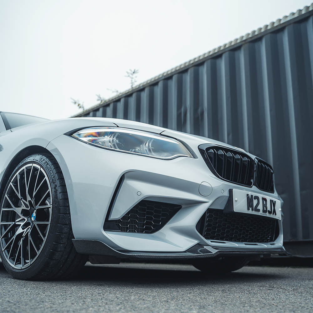 BMW M2C F87 carbon fibre splitter by CT Carbon, V4 version, showcasing the sleek, lightweight aerodynamic car part.