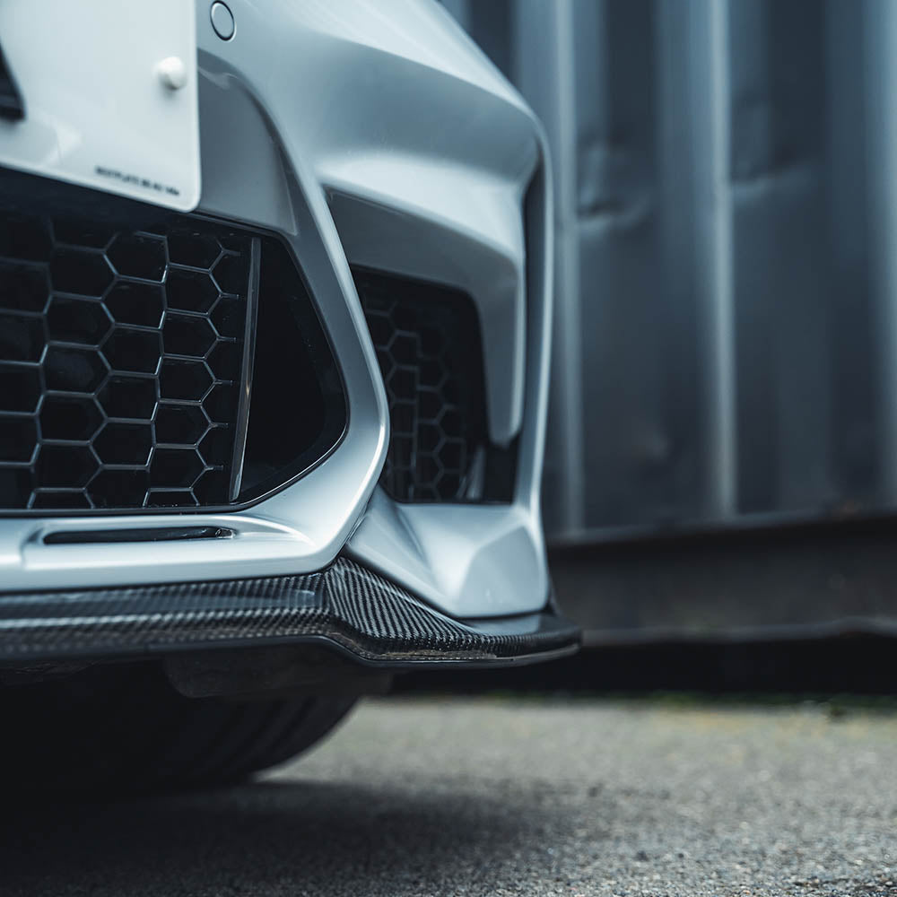 BMW M2C F87 carbon fibre splitter by CT Carbon, V4, featuring a sleek CS-style aerodynamic design for enhanced performance.