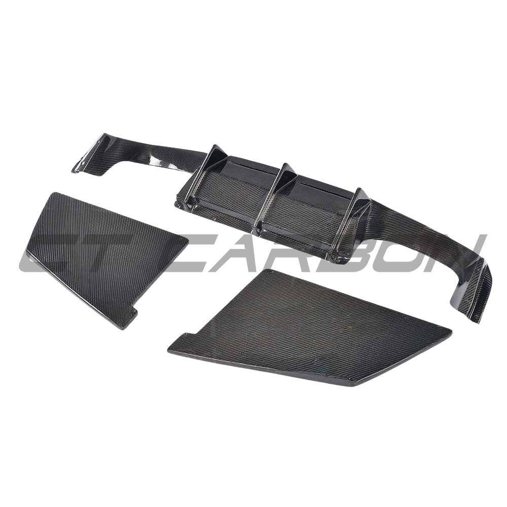 BMW M2 F87 carbon fiber diffuser by CT Carbon, V4 style, showcasing sleek aerodynamic design and carbon fiber finish.