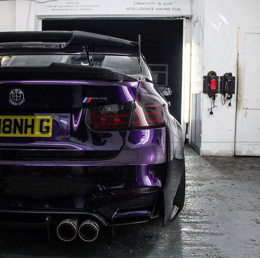 BMW M2 M3 M4 carbon fibre wing spoiler by CT Carbon, V2 style, showcasing sleek carbon fiber design on the vehicle.