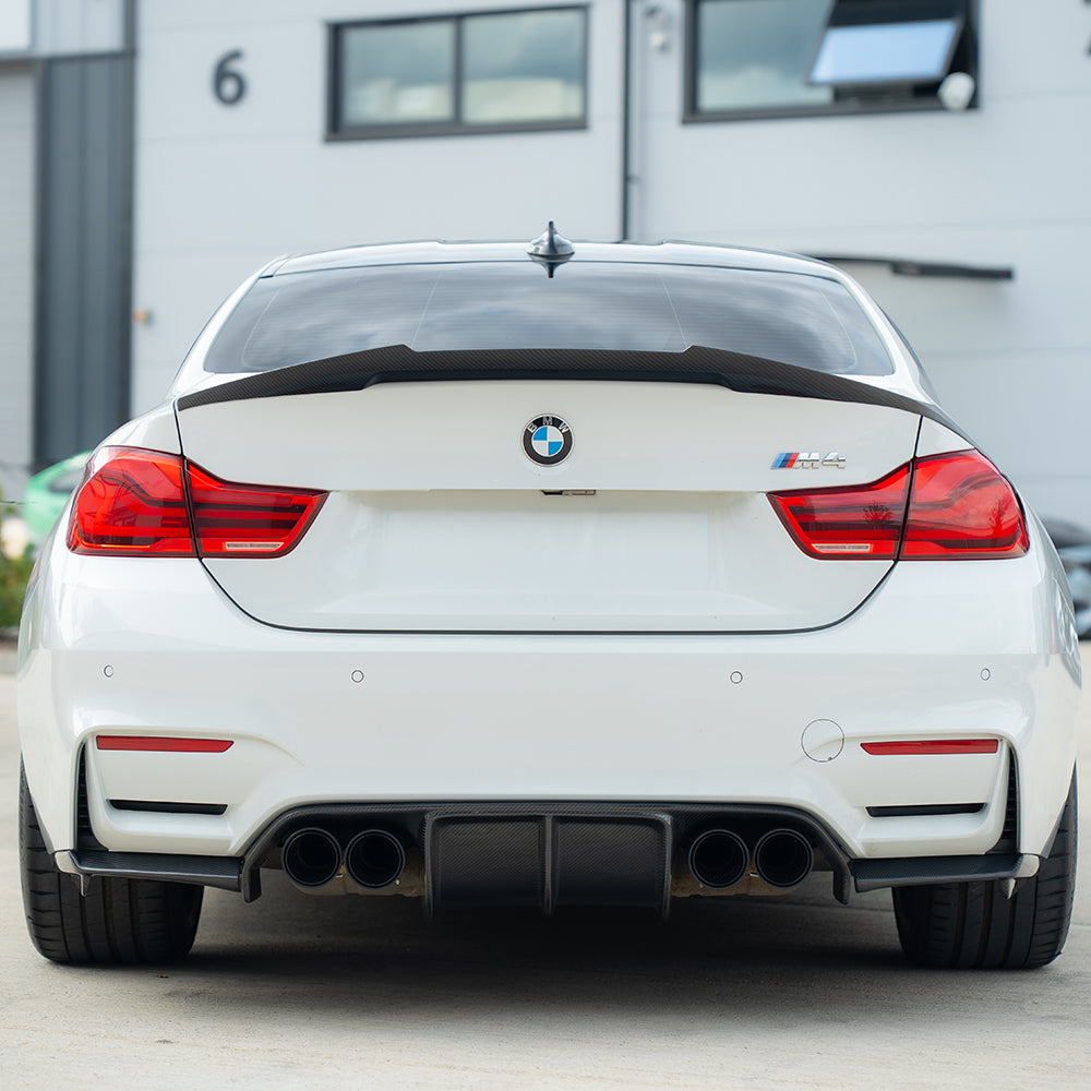 Set of four black carbon fiber exhaust tips for BMW M2, M3, M4, M5, F10, F80, F82, F83, F87 models by CT Carbon
