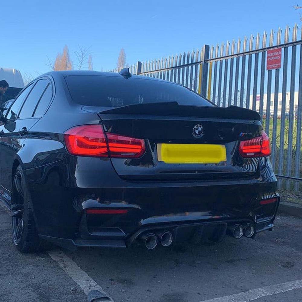 BMW M3 F80 F30 carbon fibre spoiler by CT Carbon, V3 model, featuring a sleek ducktail style on a sporty car.