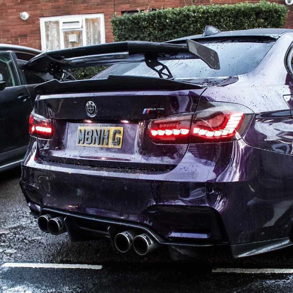 BMW M3 F80 and F30 3 Series carbon fiber spoiler by CT Carbon, V3 ducktail style, mounted on the rear of the car.