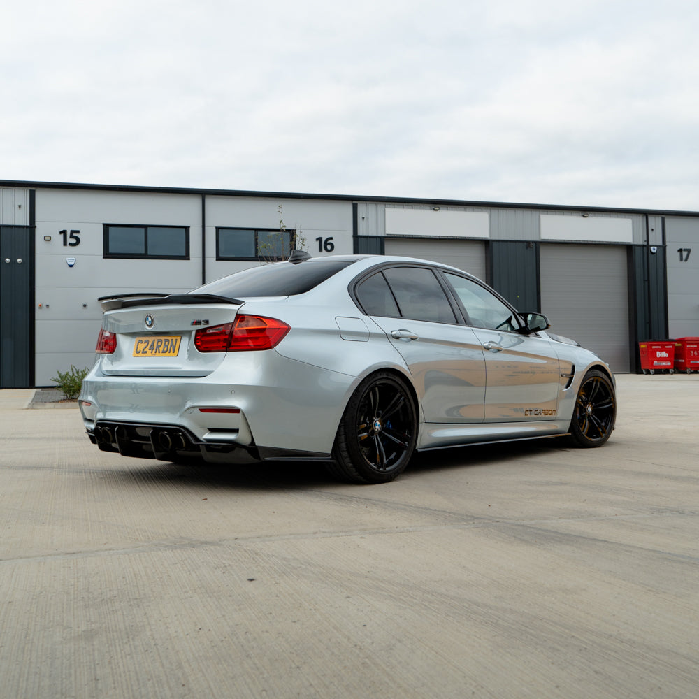 BMW M3 M4 F80 F82 F83 CT Carbon fiber diffuser for sporty rear aerodynamic upgrade, featuring sleek carbon fiber design.