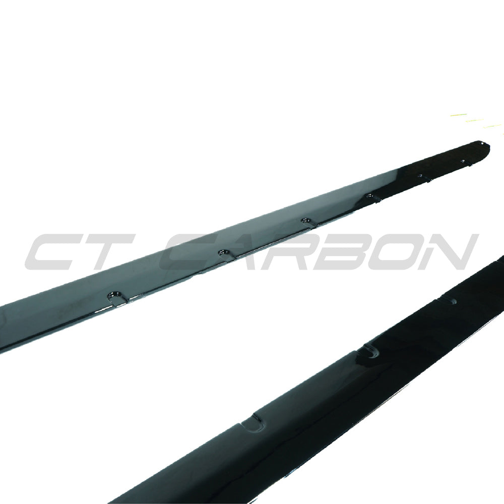 BMW M3 G80 G81 side skirts in gloss black by CT Carbon, showcasing sleek, aerodynamic design for enhanced sporty appearance.