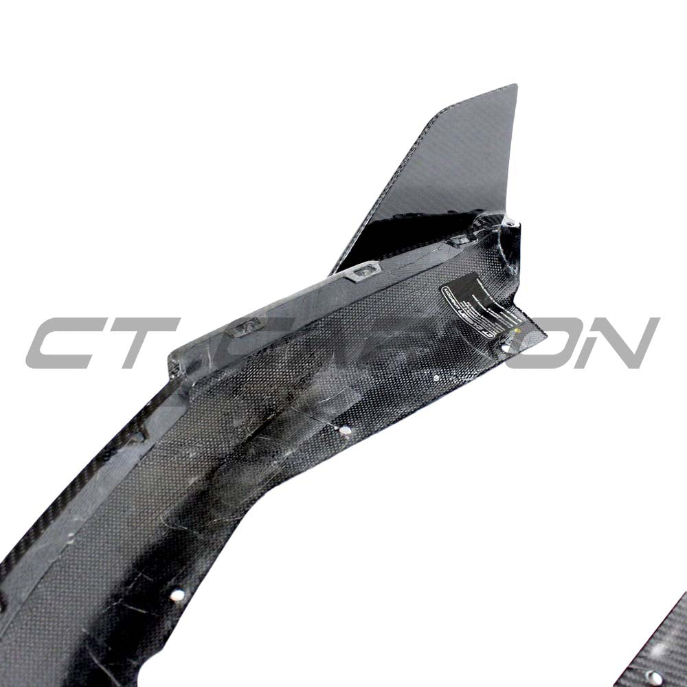 BMW G80 G81 M3 carbon fibre rear bumper corners by CT Carbon, visible close-up of sleek, lightweight accessory for vehicle enhancement.