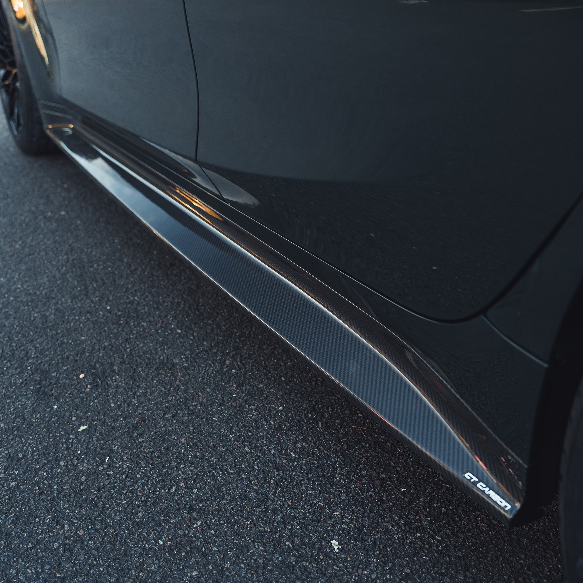 BMW M3 G80 G81 carbon fibre side skirt replacement by CT Carbon, showcasing sleek, lightweight side skirts for enhanced aerodynamics.
