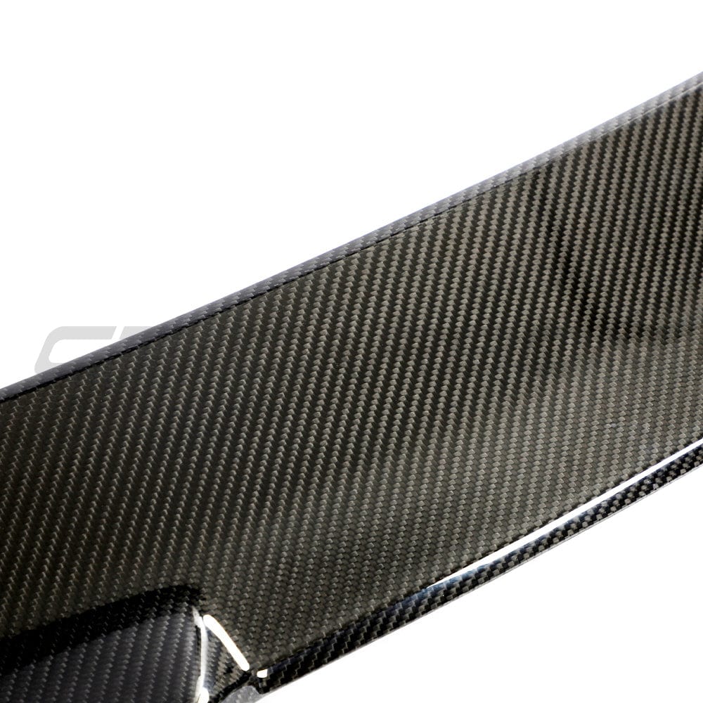 BMW M3 G81 G21 carbon fibre spoiler by CT Design, showcasing sleek, lightweight aerodynamic car accessory on a sporty vehicle.