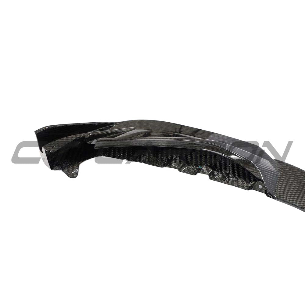 BMW M3 M4 G80 G81 G82 G83 carbon fiber front end pack by CT Carbon, featuring a sleek carbon fiber splitter on the car's front end.