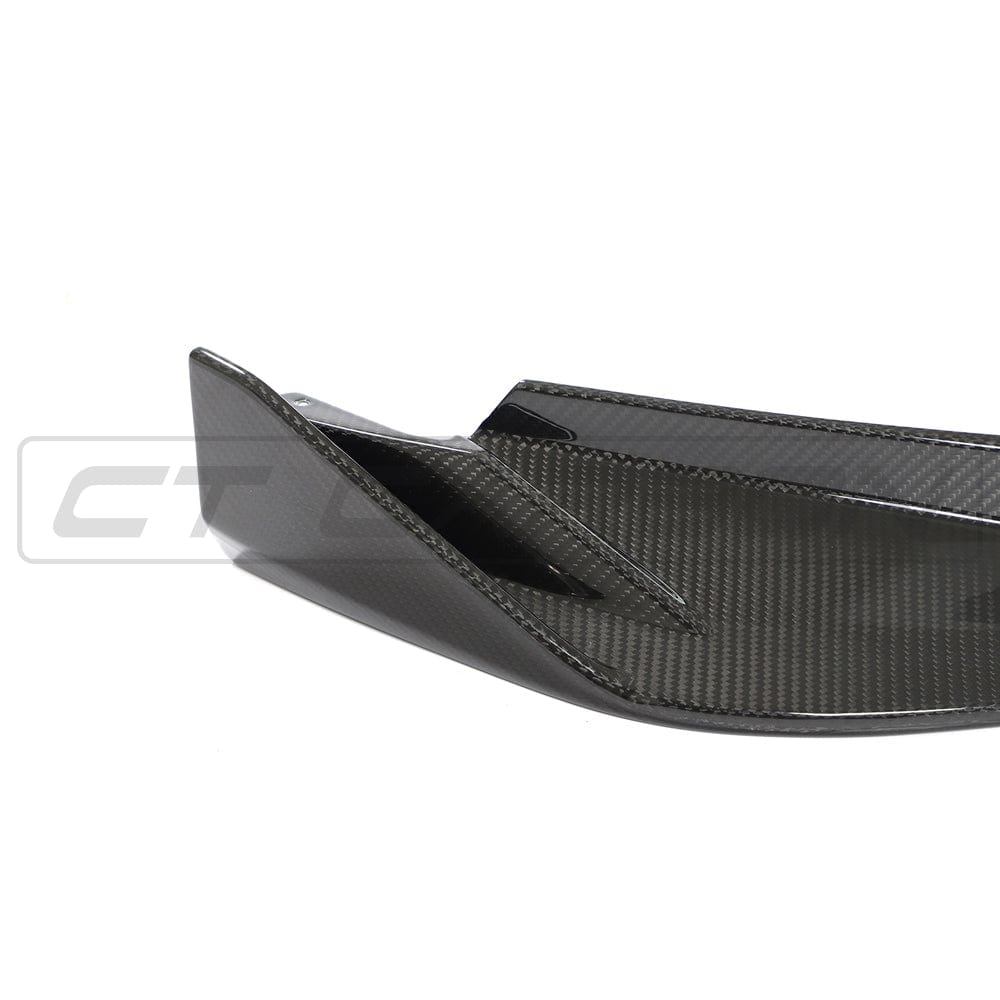 BMW G82 M4 full carbon fibre kit by CT Design, including front splitter and side panels, showcasing sleek black carbon fibre details.
