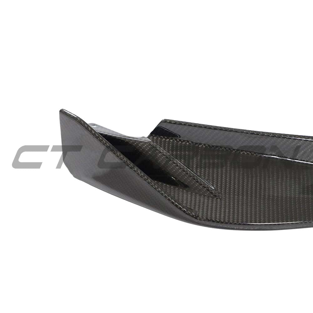 BMW G82 M4 full carbon fibre kit by CT Carbon, showing the sleek carbon fibre splitter and aerodynamic enhancements.
