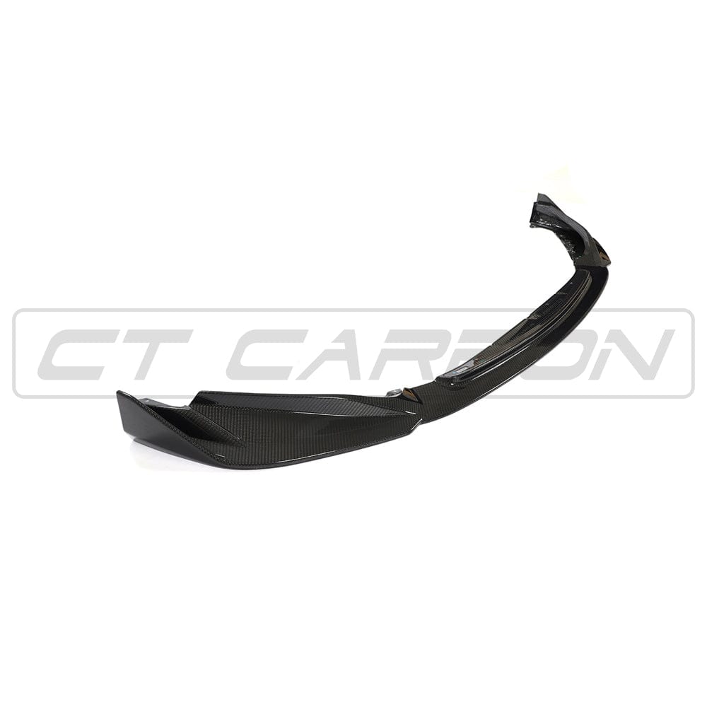 BMW G82 M4 carbon fibre kit by CT Carbon, featuring full carbon fibre splitter and aerodynamic components on a sleek M4 model.