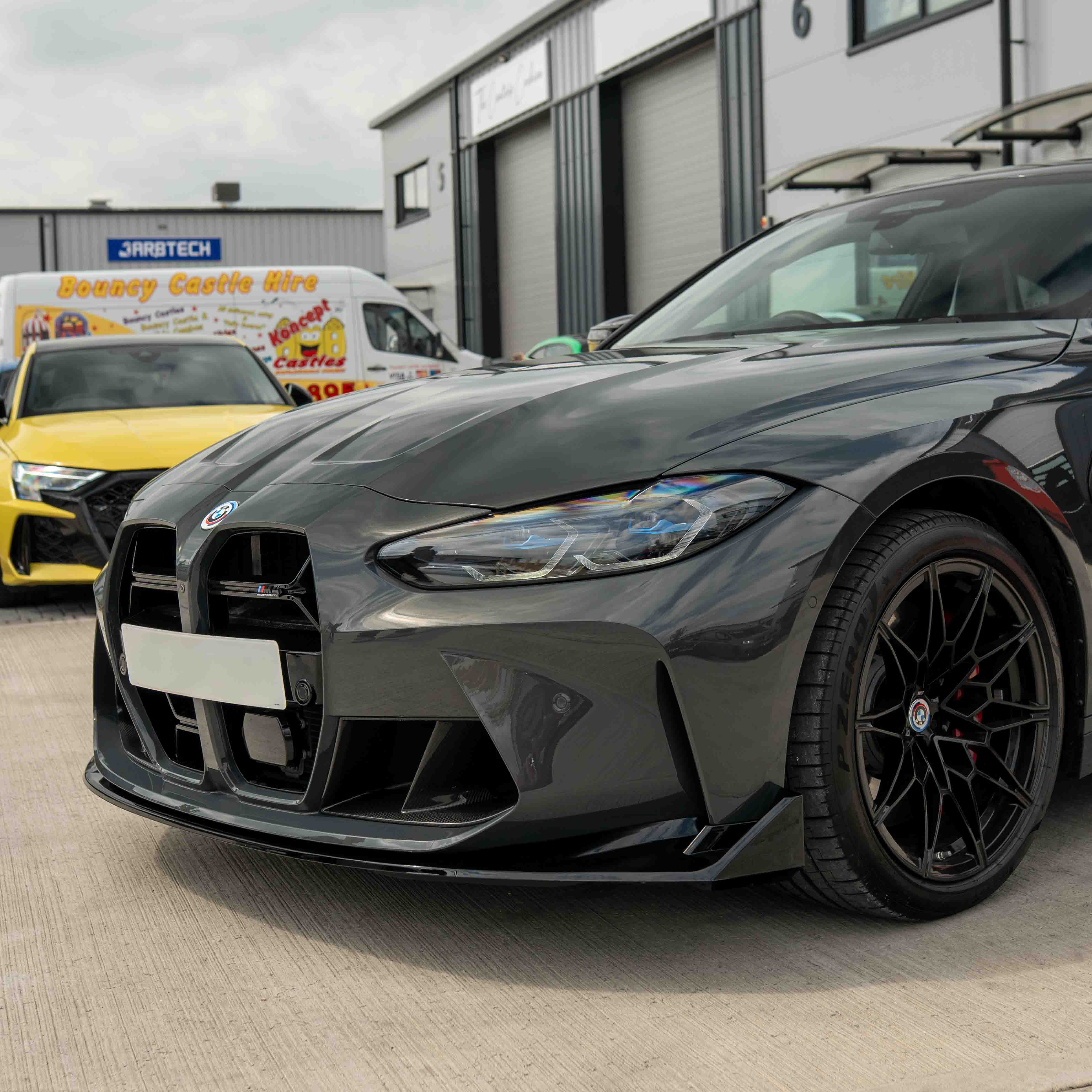 BMW M3 M4 G80 G81 G82 G83 CT Carbon gloss black splitter in CSL style, showcasing its sleek aerodynamic design.