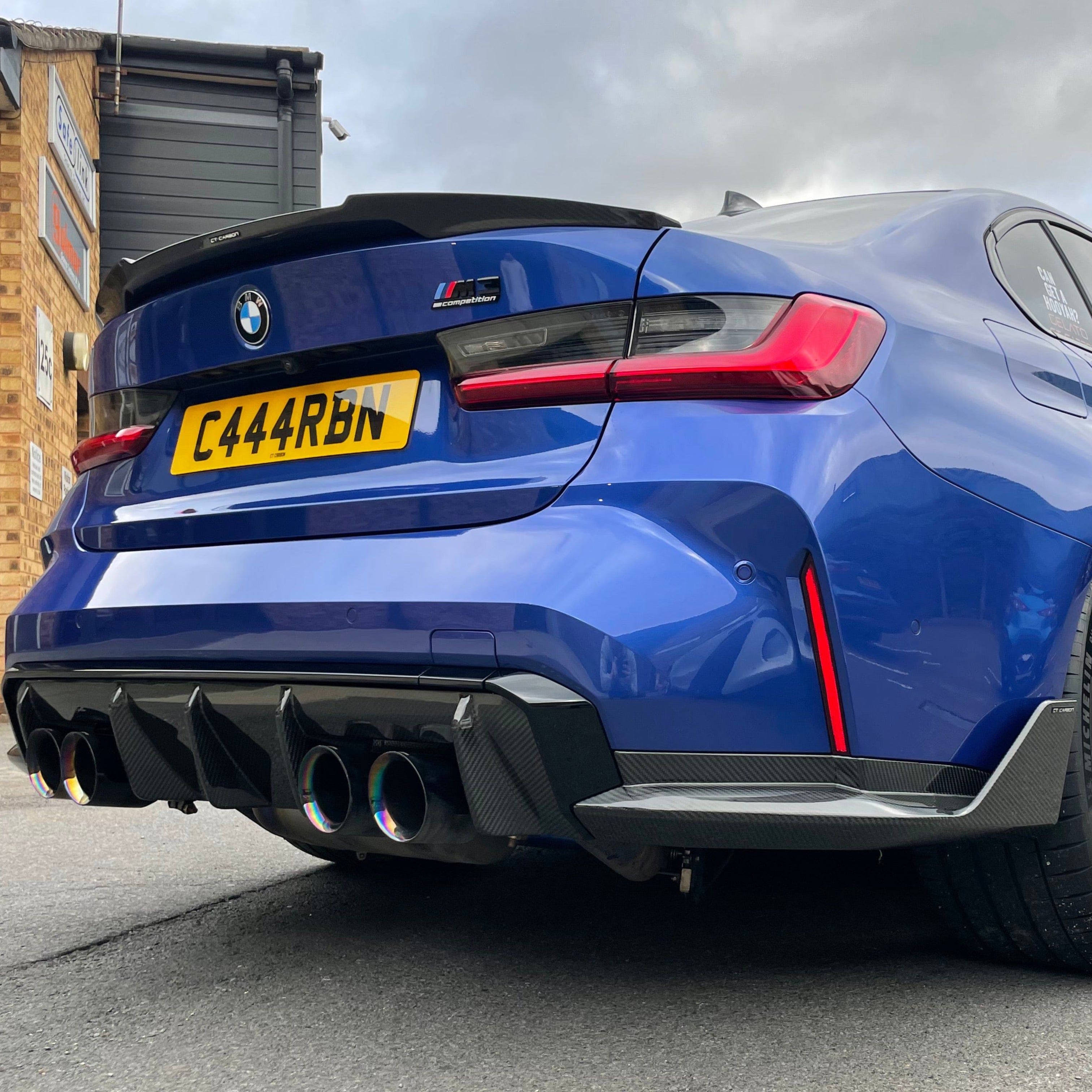 BMW M3 G80 G20 carbon fibre spoiler by CT Carbon, V8 style, mounted on the rear of the 2018+ sports sedan.