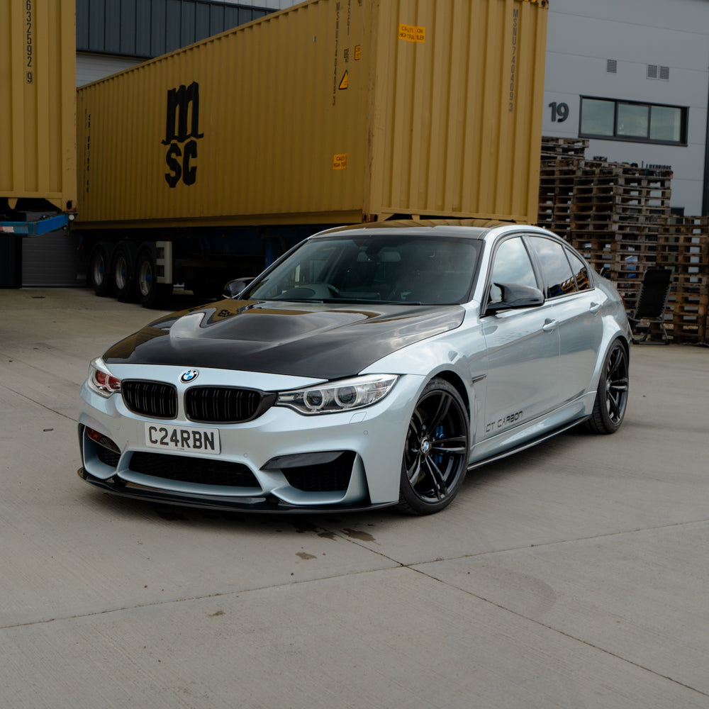 BMW M3 M4 F80 F82 F83 carbon fibre bonnet by CT Carbon, showing sleek, lightweight design with visible carbon weave.