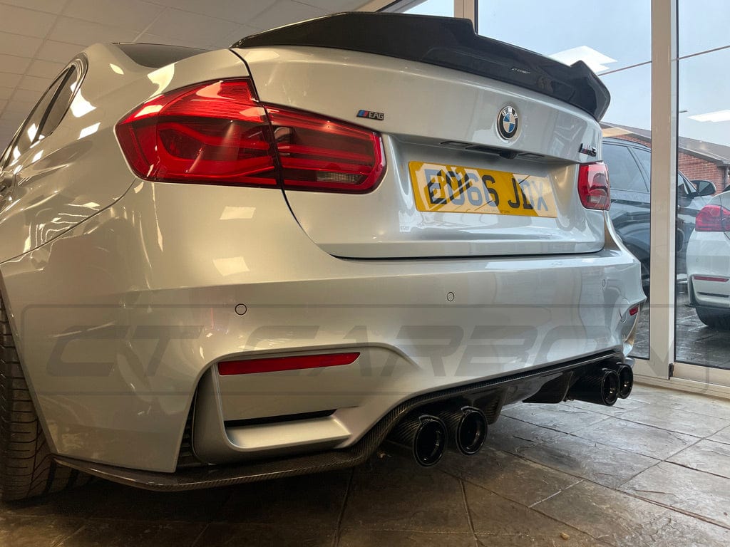 BMW M3 M4 F80 F82 F83 carbon fibre diffuser by CT Carbon, showcasing a sleek 3D style design on a sporty car.