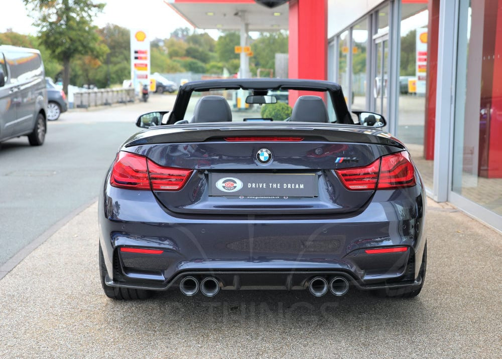 BMW M3 M4 F80 F82 F83 carbon fiber diffuser by CT Carbon, showcasing a sleek 3D style design on a sporty vehicle.