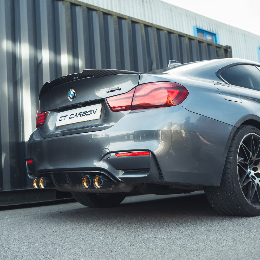 BMW M3 M4 F80 F82 F83 carbon fiber diffuser by CT Carbon, showcasing its sleek, aerodynamic design and high-quality finish.