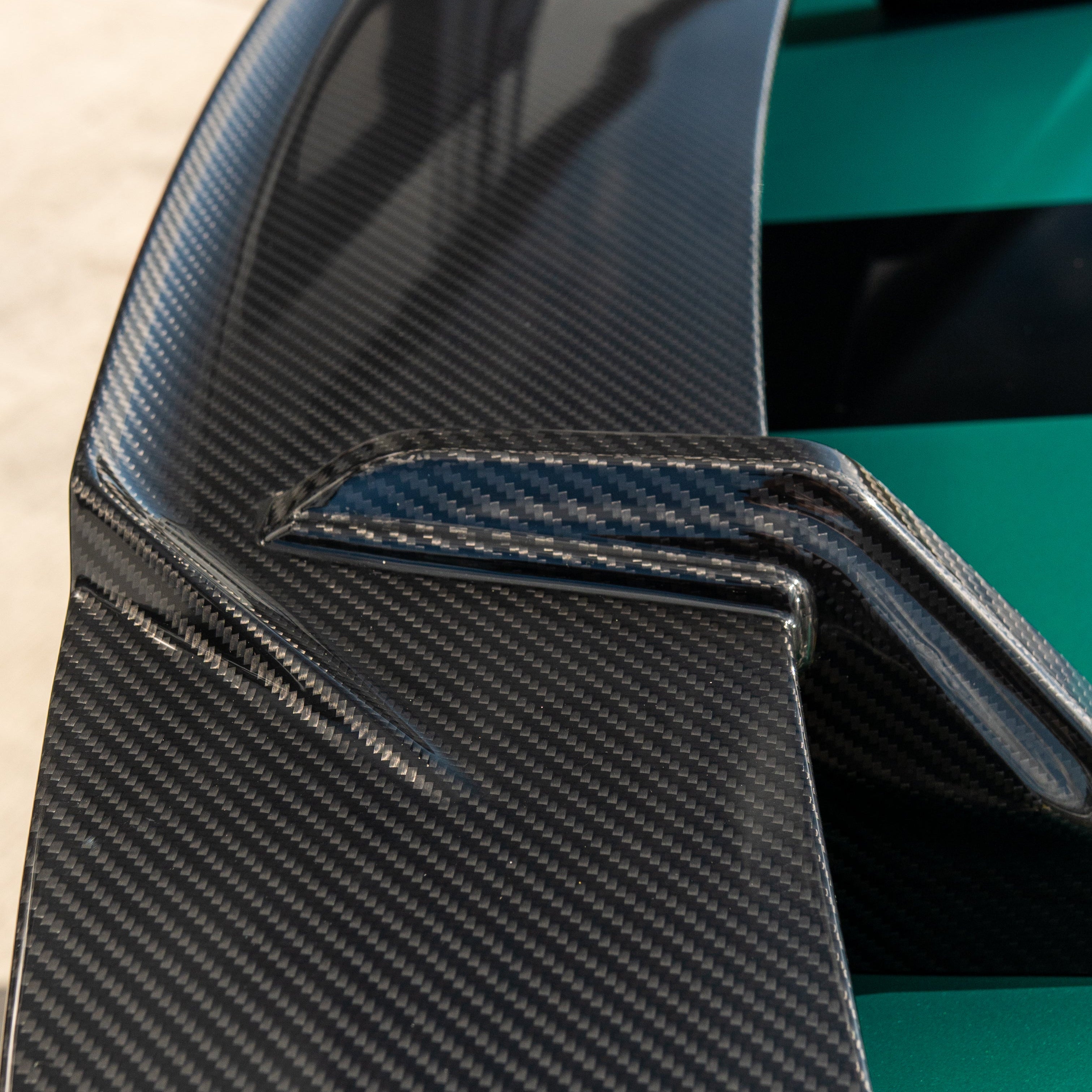 BMW G80 M3 and G82 M4 carbon fibre wing spoiler by CT Carbon, showcasing sleek, lightweight aerodynamic design.
