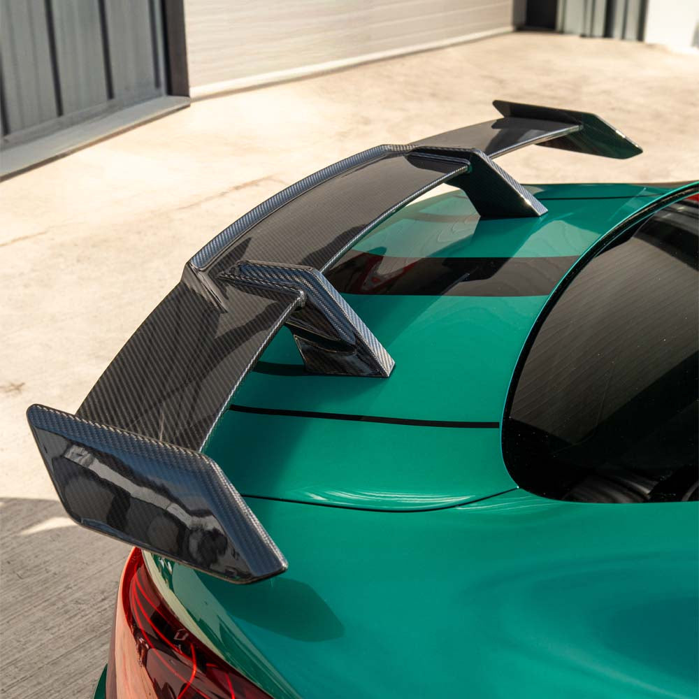 BMW G80 M3 and G82 M4 carbon fibre spoiler by CT Carbon, showcasing the sleek MP-style wing on the sports car.
