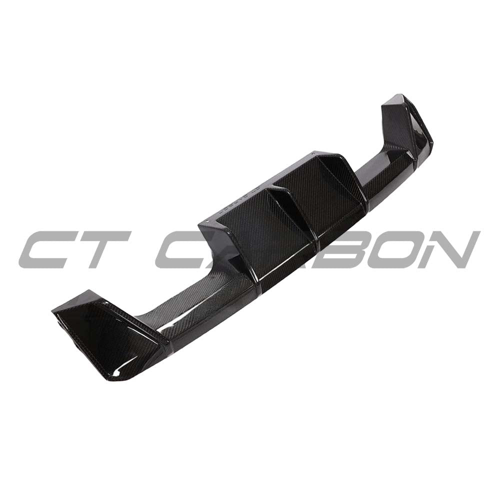 BMW M3 M4 G80 G82 G83 carbon fibre diffuser by CT Carbon, V2 style, showcasing sleek, aerodynamic design for performance vehicles.