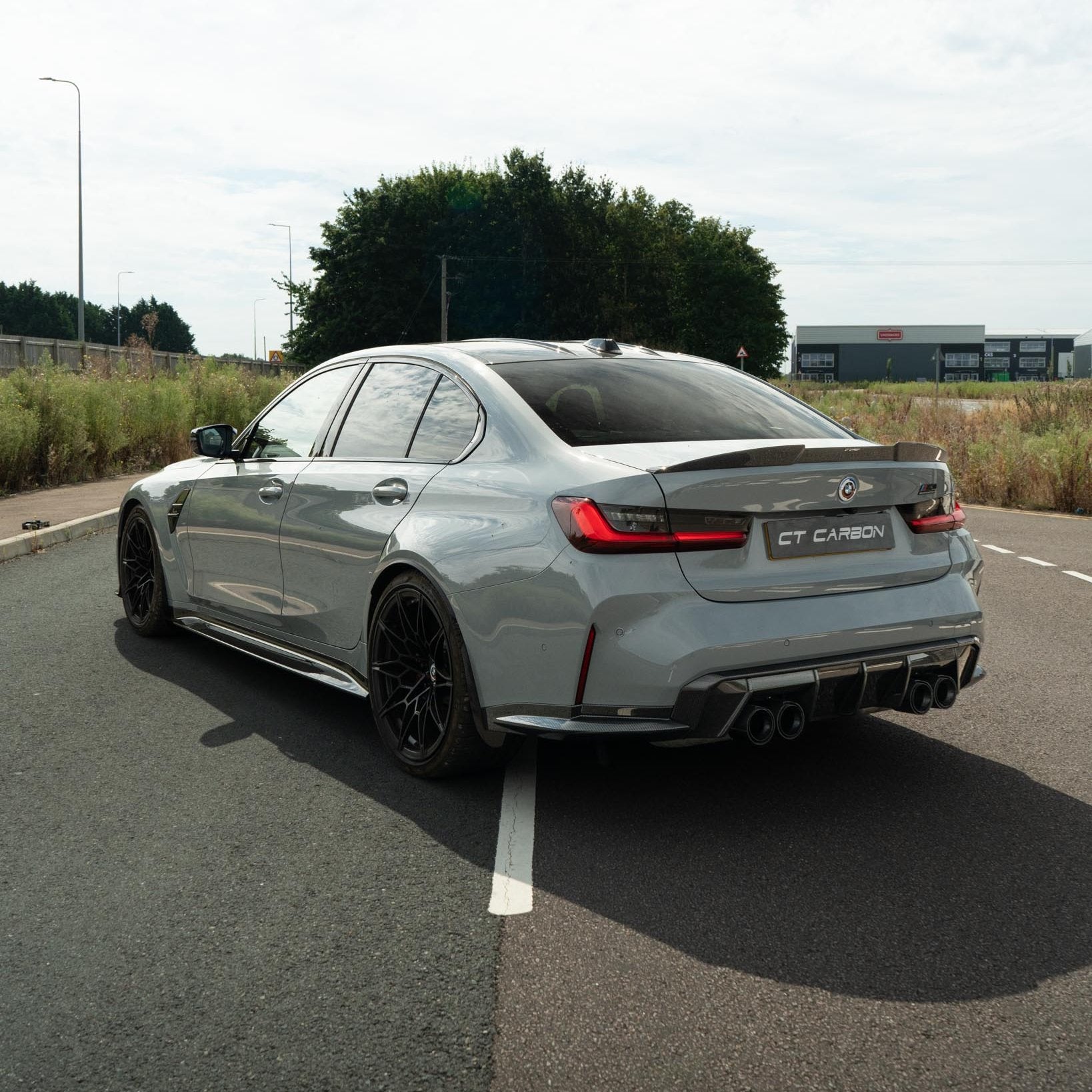 BMW M3 M4 G80 G82 G83 carbon fiber diffuser by CT Carbon, featuring a sleek MP style design for enhanced aerodynamics.