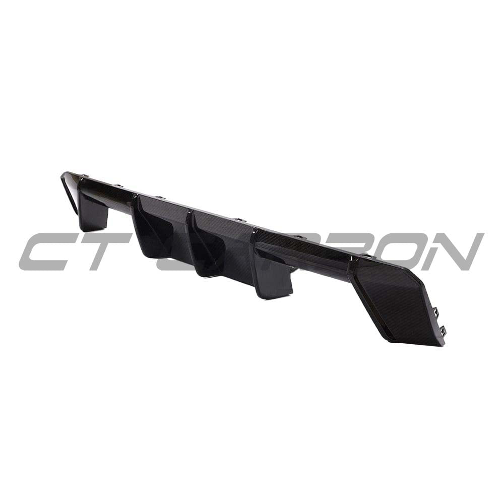 BMW M3 M4 G80 G82 G81 G83 CT Carbon fiber diffuser V2, sleek automotive rear diffuser with a textured carbon fiber finish.