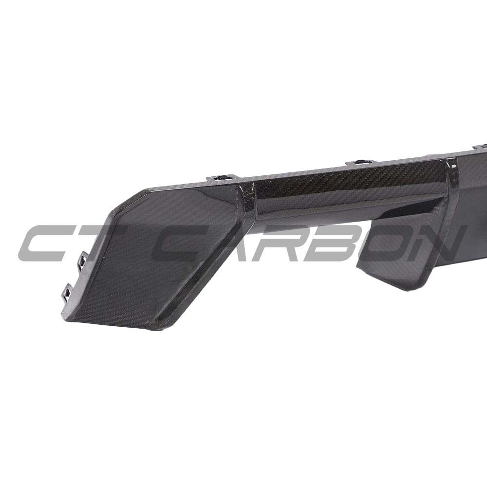 BMW M3 M4 G80 G82 carbon fiber diffuser by CT Carbon, V2 style, featuring sleek, lightweight aerodynamic design for sporty appeal.