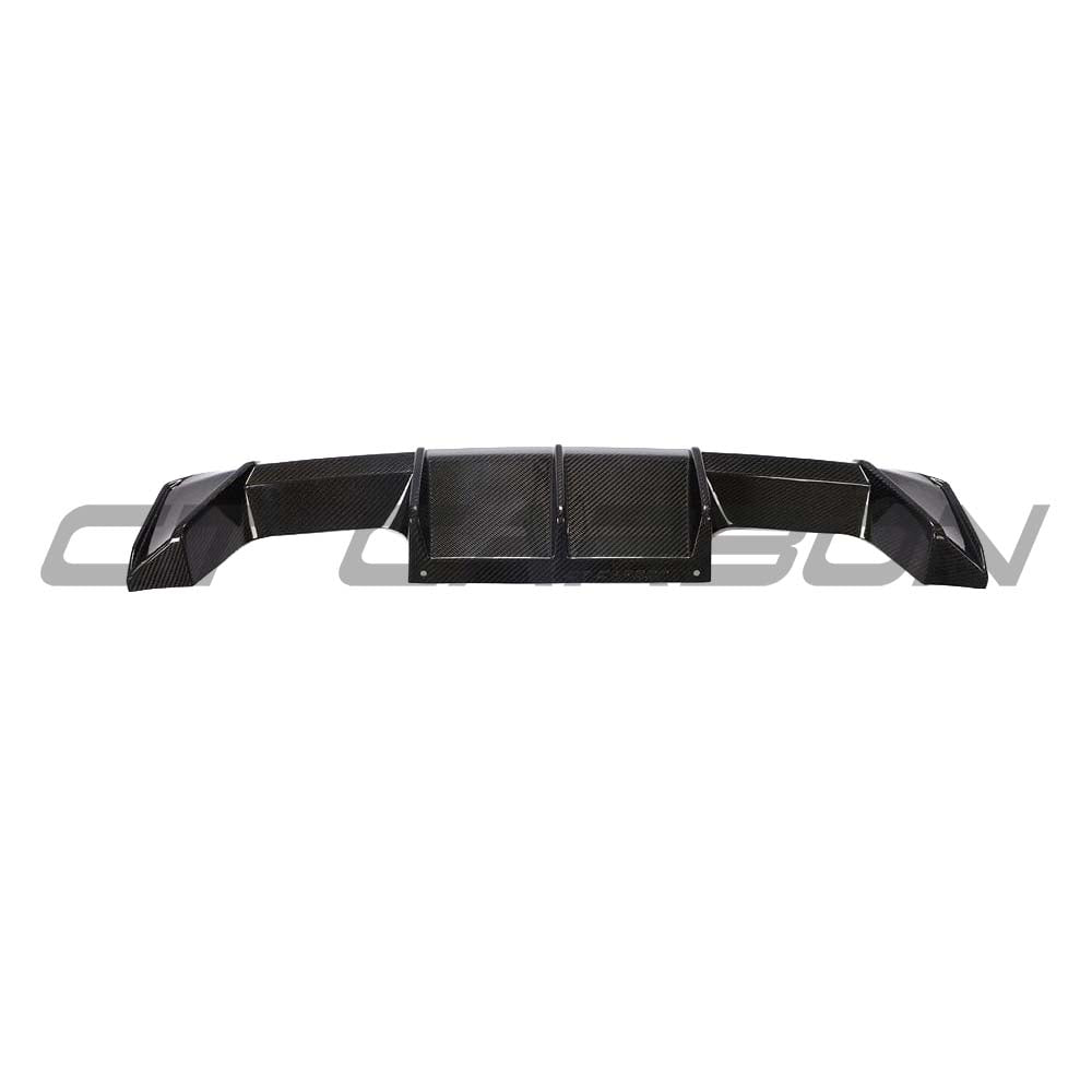 BMW M3 M4 G80 G82 G83 carbon fiber diffuser by CT Carbon, V2 style, showcasing sleek, textured carbon fiber design for sporty performance.