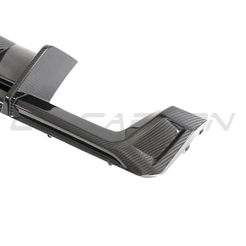 BMW M3 M4 G80 G81 G82 G83 carbon fiber diffuser with integrated LED lights, designed by CT Carbon for a sleek, performance-enhancing look.