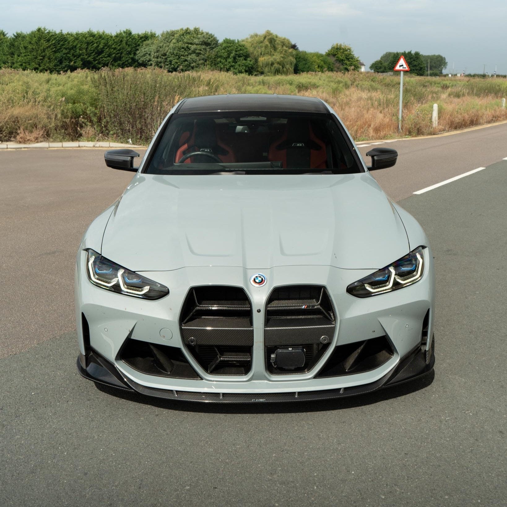 BMW M3 M4 G80 G82 carbon fibre bumper ducts by CT Carbon, showing sleek, lightweight grille accessories with a carbon fibre finish.