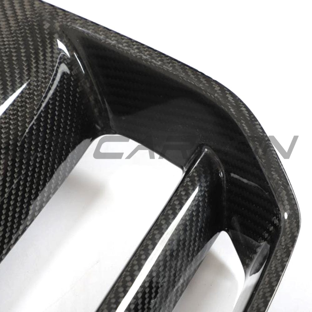 BMW M3 M4 G80 G82 carbon fibre front end pack by CT Carbon, featuring grille without accessories, showcasing sleek carbon fiber design.