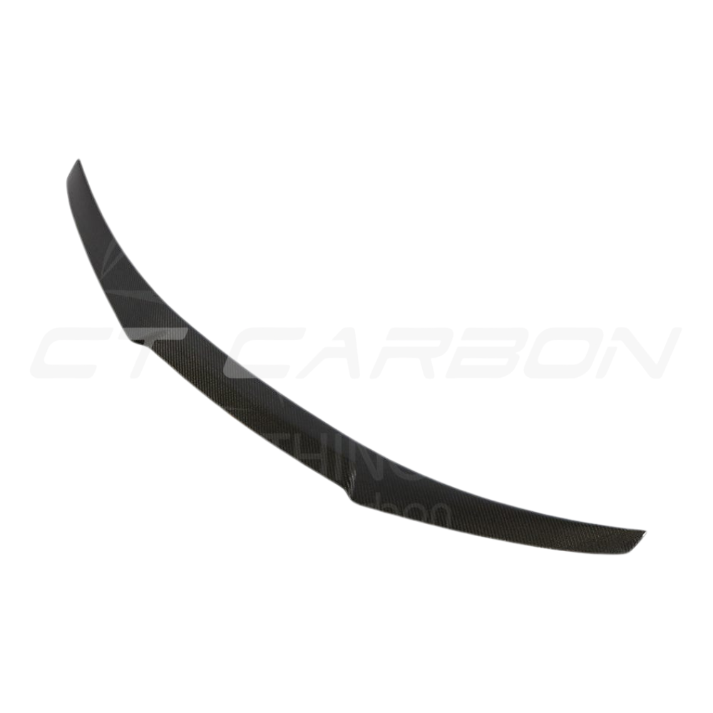 BMW M4 F82 carbon fiber V-style spoiler by CT Carbon, showcasing the sleek, aerodynamic design on the vehicle.