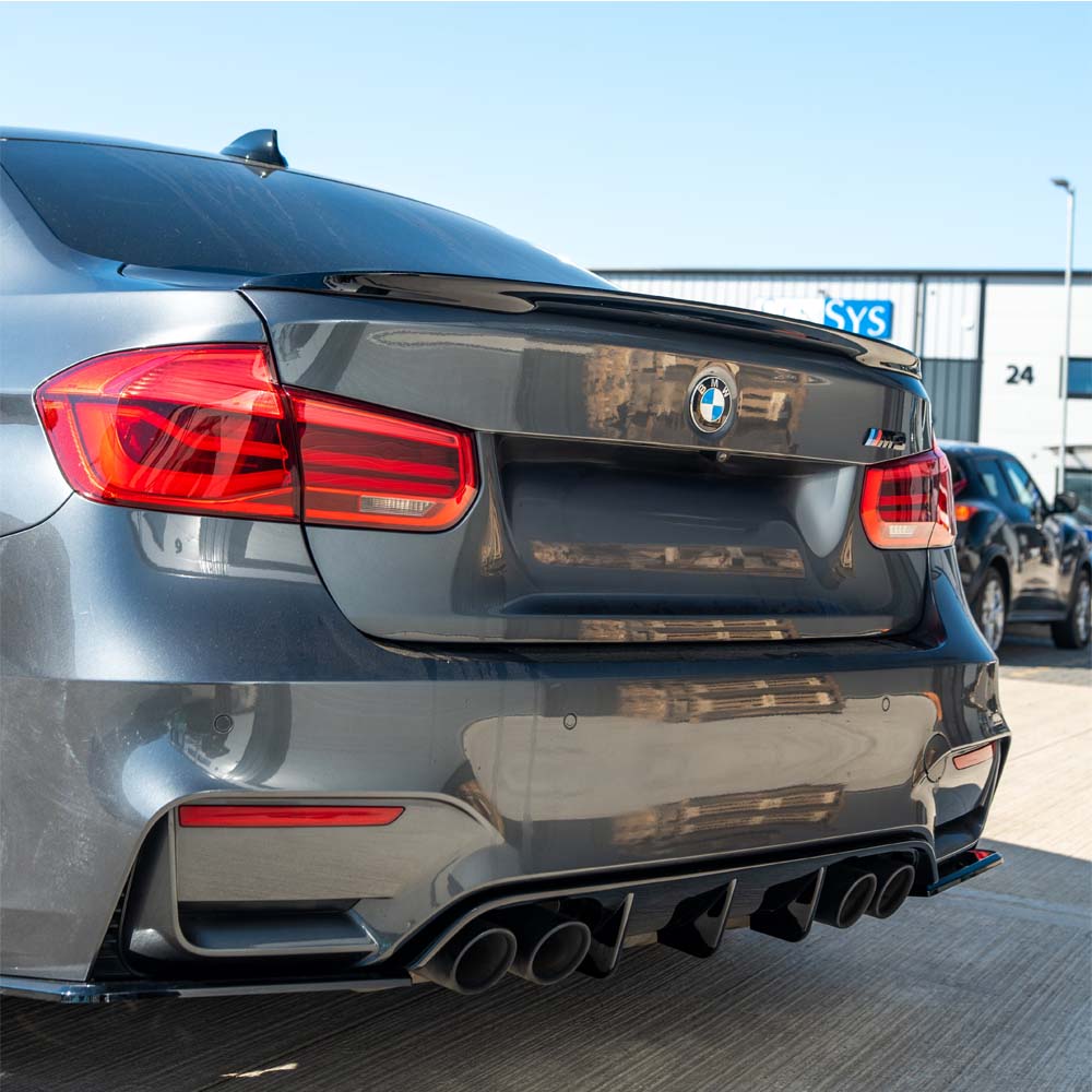 BMW M4 (F82) coupe full gloss black kit by CT Carbon, featuring sleek black exterior accessories and modifications.