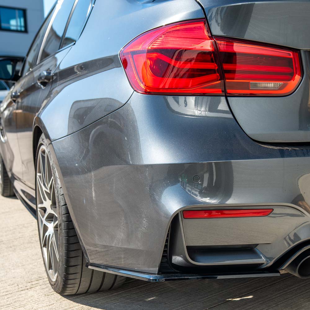 BMW M3 (F80) 2014-2020 CT Carbon full gloss black kit installed on the car, showcasing sleek black accents and aerodynamic enhancements.