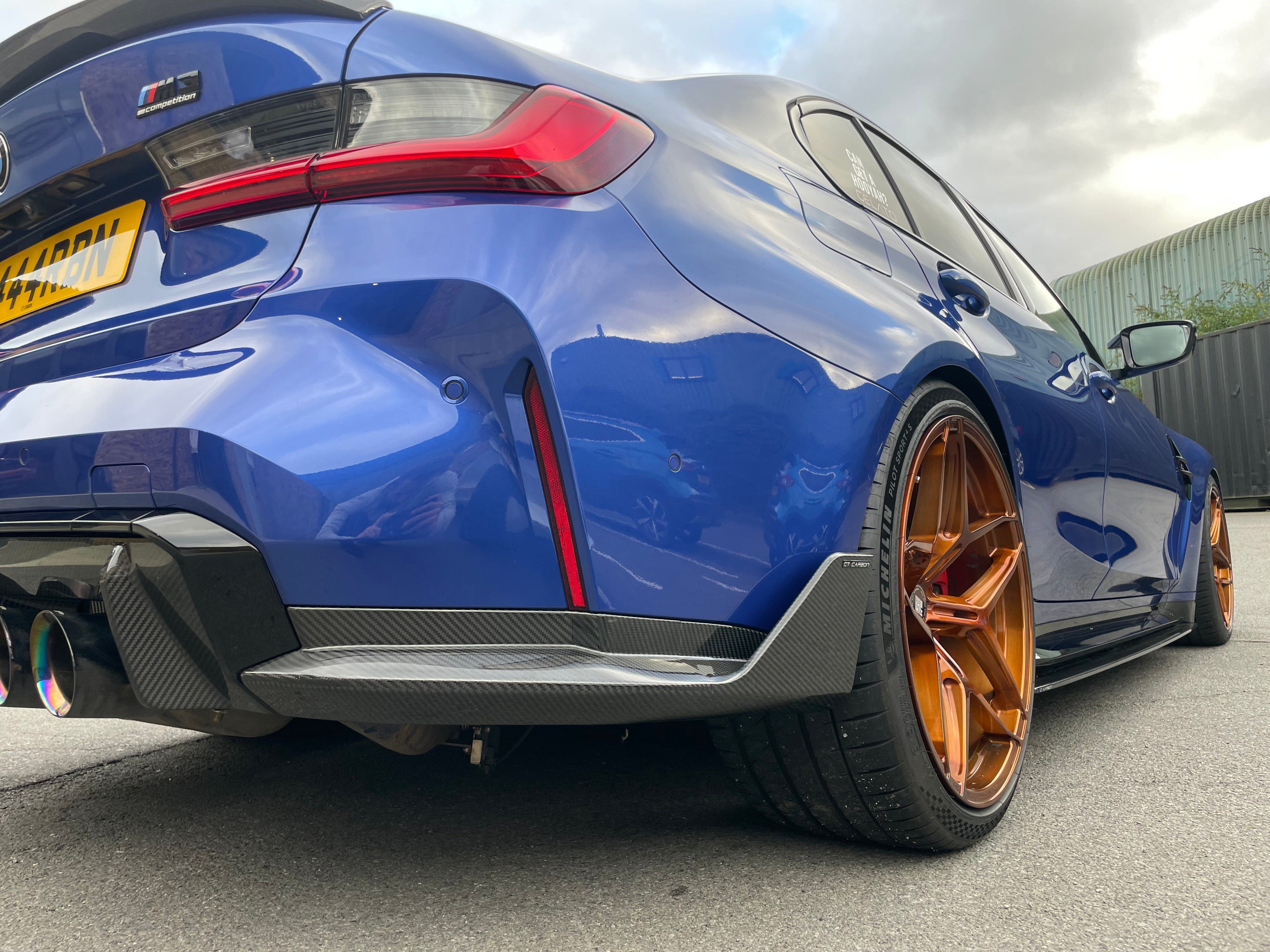 BMW M4 G82 G83 Carbon Fibre Rear Bumper Corners from CT Carbon, V1 accessory, showing sleek carbon fiber detailing on the bumper corners.