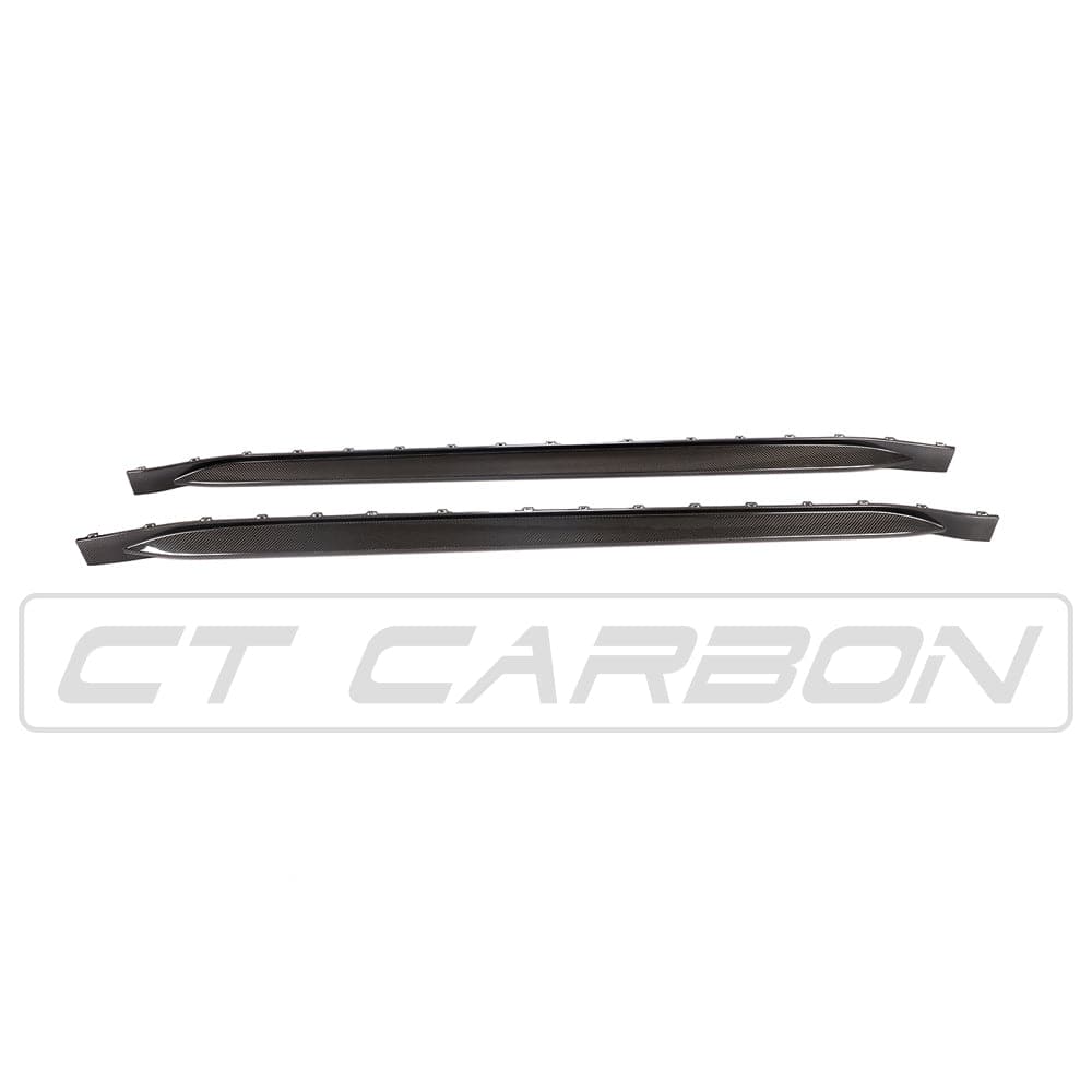 BMW M4 G82 G83 carbon fibre side skirt replacement by CT Carbon, showing sleek design and textured finish on the side of the car.