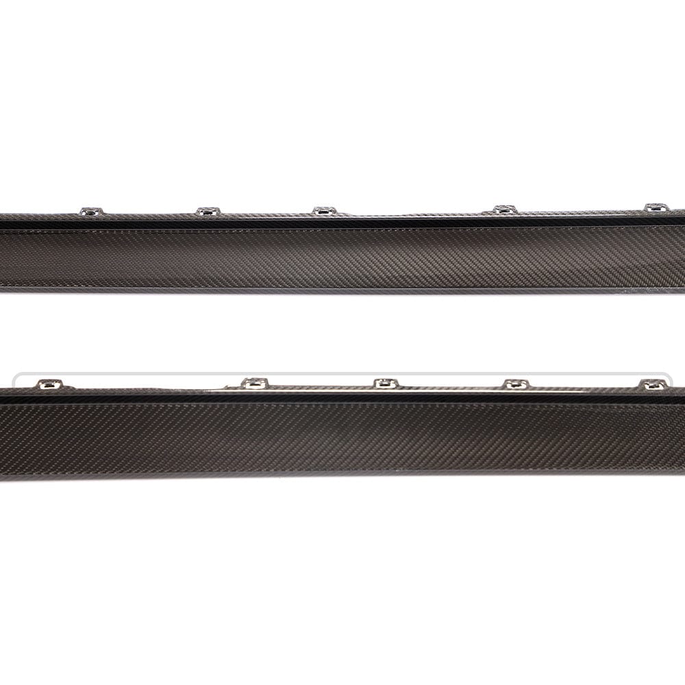BMW M4 G82/G83 carbon fibre side skirt replacement by CT Design, showing the sleek, textured carbon fiber side skirt on the vehicle.
