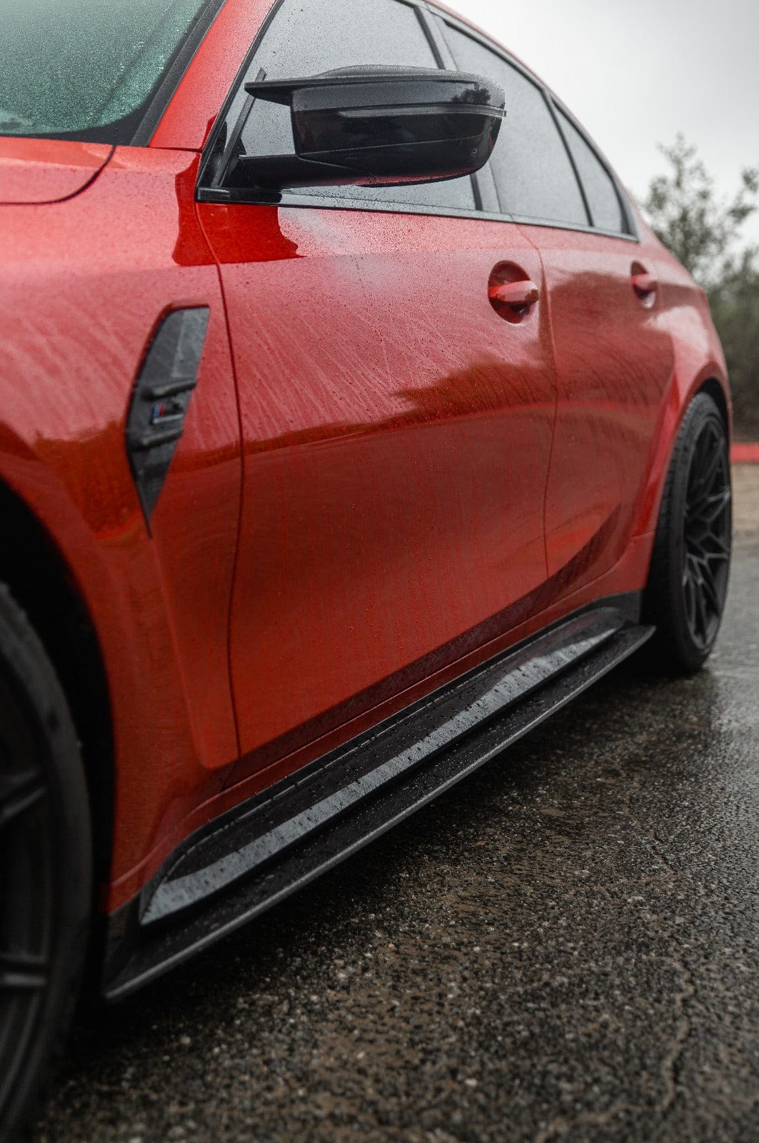 BMW M4 G82 G83 carbon fibre side skirt replacement and extension by CT Design, showcasing sleek, lightweight automotive styling.