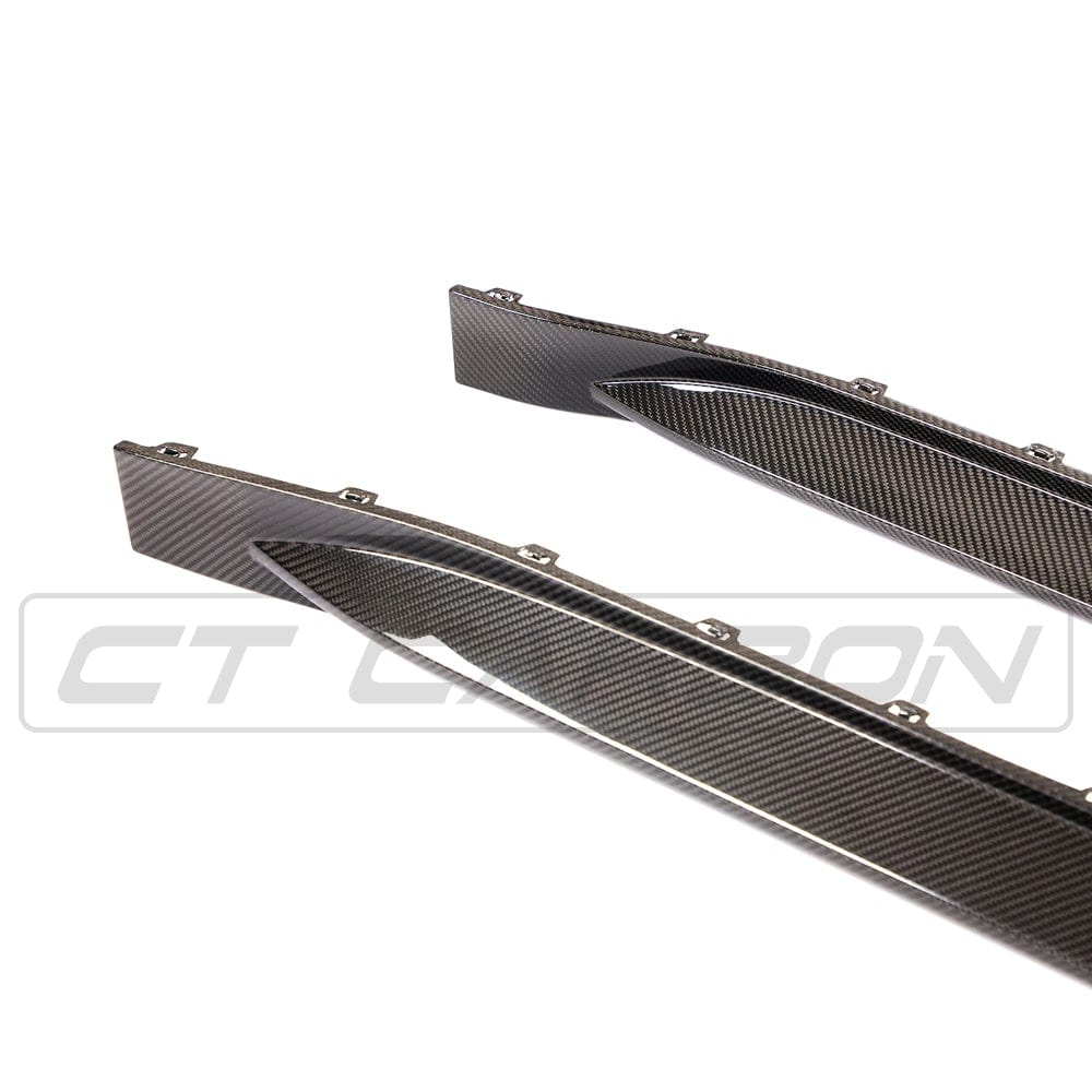 BMW M4 G82/G83 CT Carbon fiber side skirt replacement and extension, showcasing sleek carbon fiber finish and aerodynamic design.