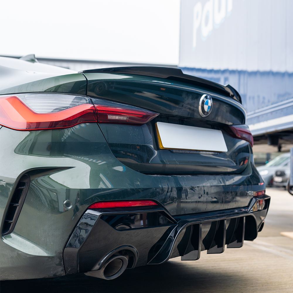 BMW M4 G82 G22 carbon fibre spoiler by CT Carbon, showcasing sleek, lightweight M4-style spoiler design on a luxury sports car.