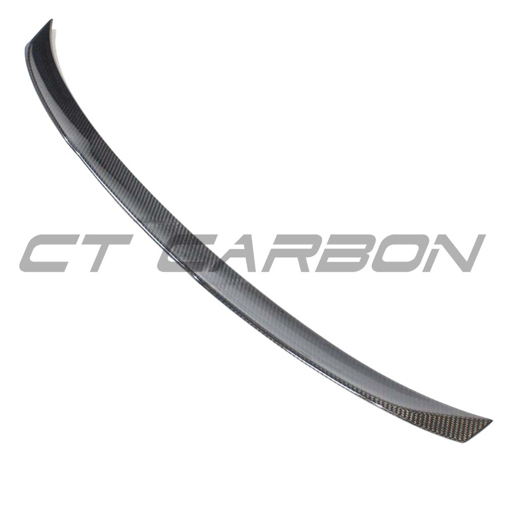 BMW G22 4 Series carbon fibre kit by CT Carbon, featuring a spoiler and MP style components on a sleek black car.
