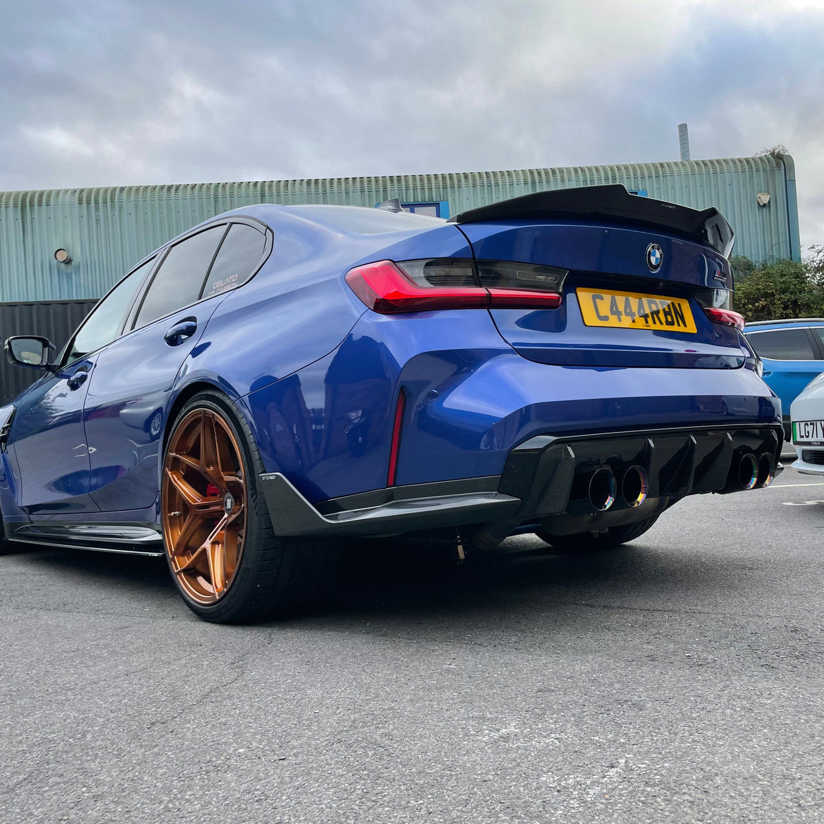 BMW M4 G82 G22 carbon fibre spoiler by CT Carbon, V1 style, showing sleek aerodynamic design on the car's rear.