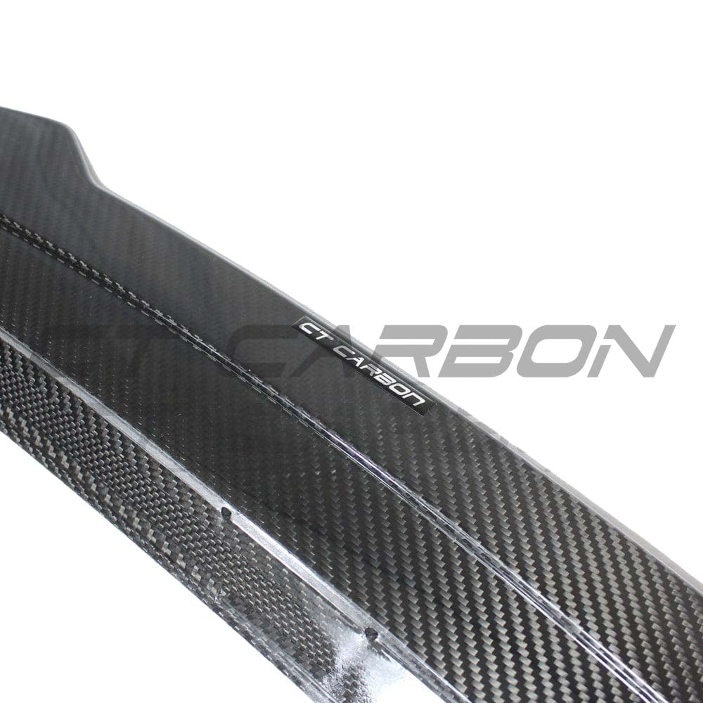 BMW G22 4 Series 2020+ Carbon Fibre Kit by CT Carbon, including a V12-style carbon fibre spoiler on a sleek car.