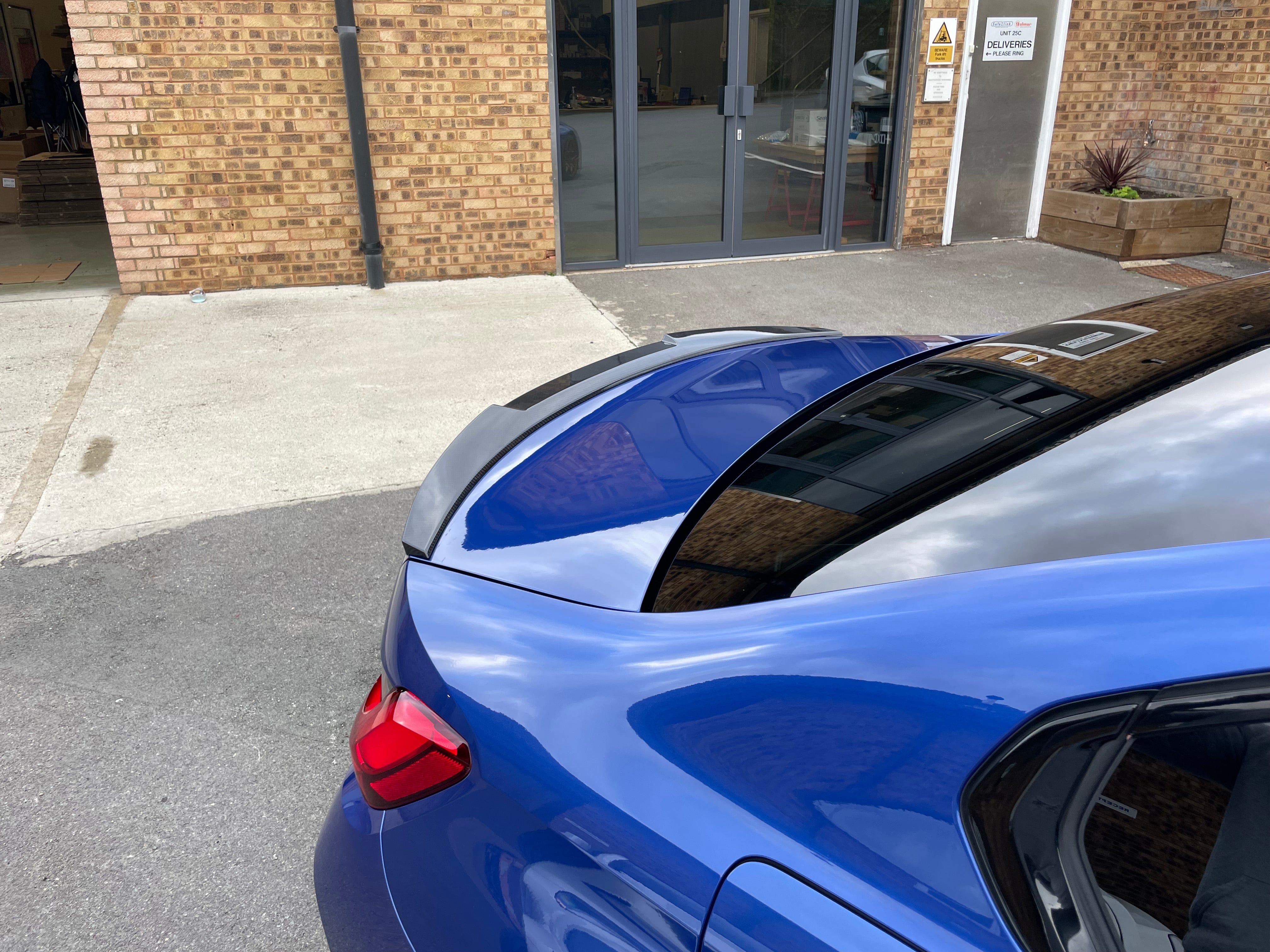 BMW M4 G82/G22 Carbon Fibre Spoiler by CT Carbon, V3 style, showing sleek carbon fiber design on the sporty car model.