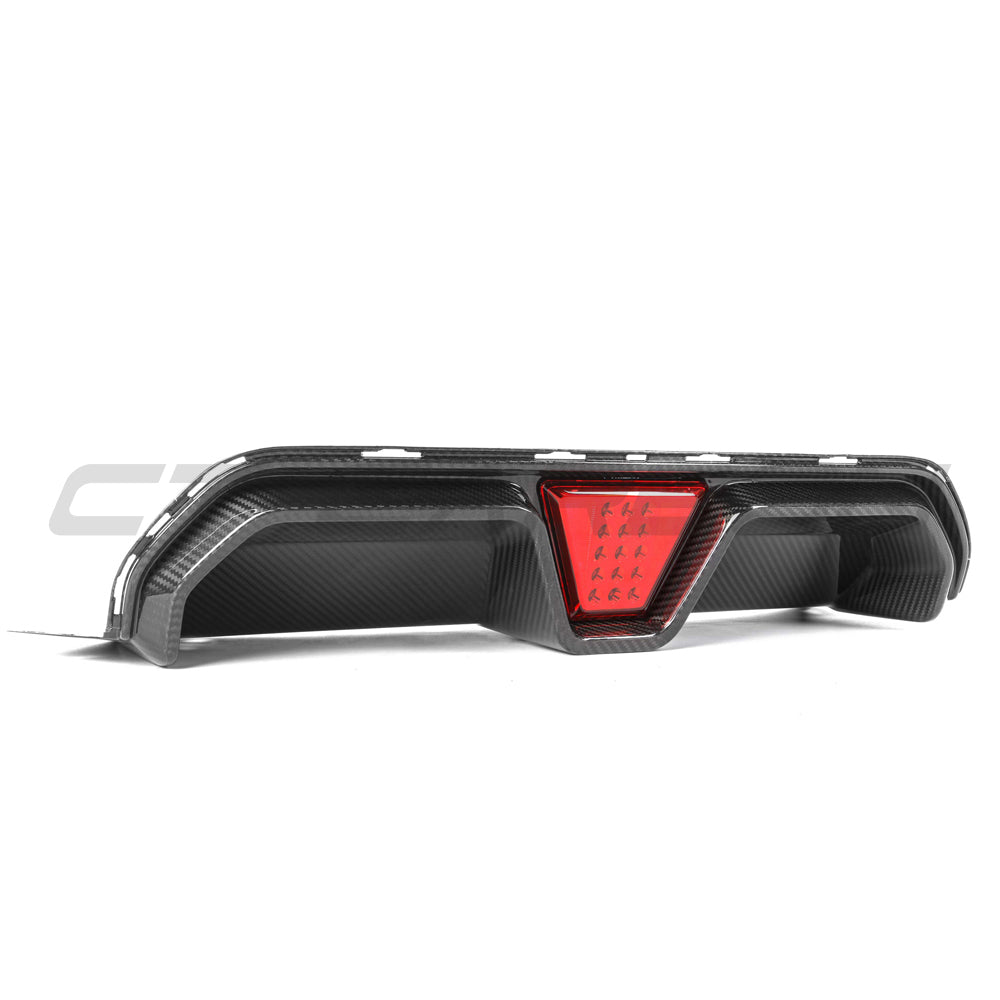 BMW M5 F90 2018-2024 CT Carbon pre-preg carbon fibre diffuser with LED lights, featuring a V4 design and CS style accents.