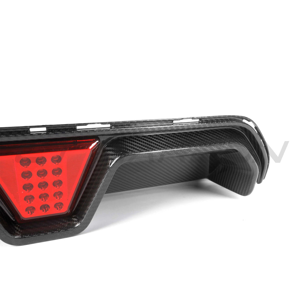 BMW M5 F90 2018-2024 CT Carbon pre-preg carbon fiber diffuser with LED lights, showcasing sleek design and V4 style details.