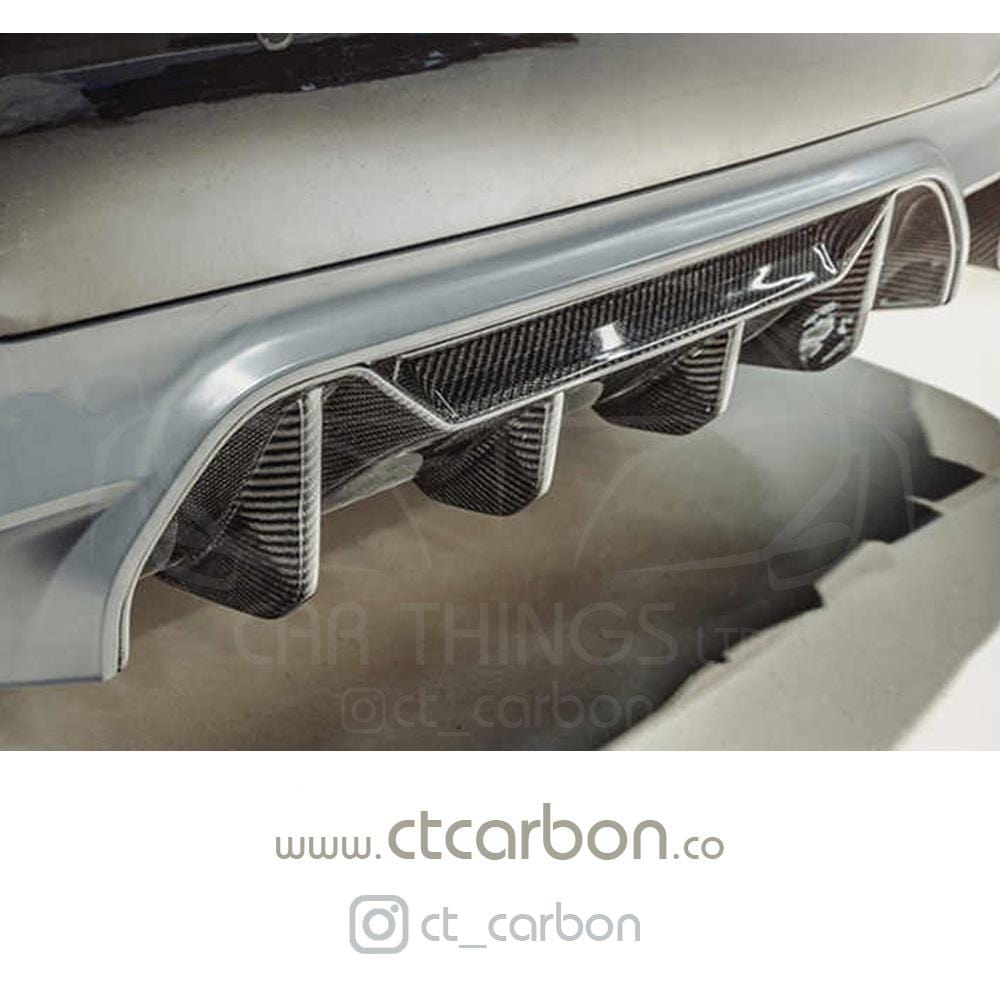 BMW M5 F90 carbon fibre diffuser by CT Carbon, V1, showcasing sleek aerodynamic design and high-quality carbon fiber finish.