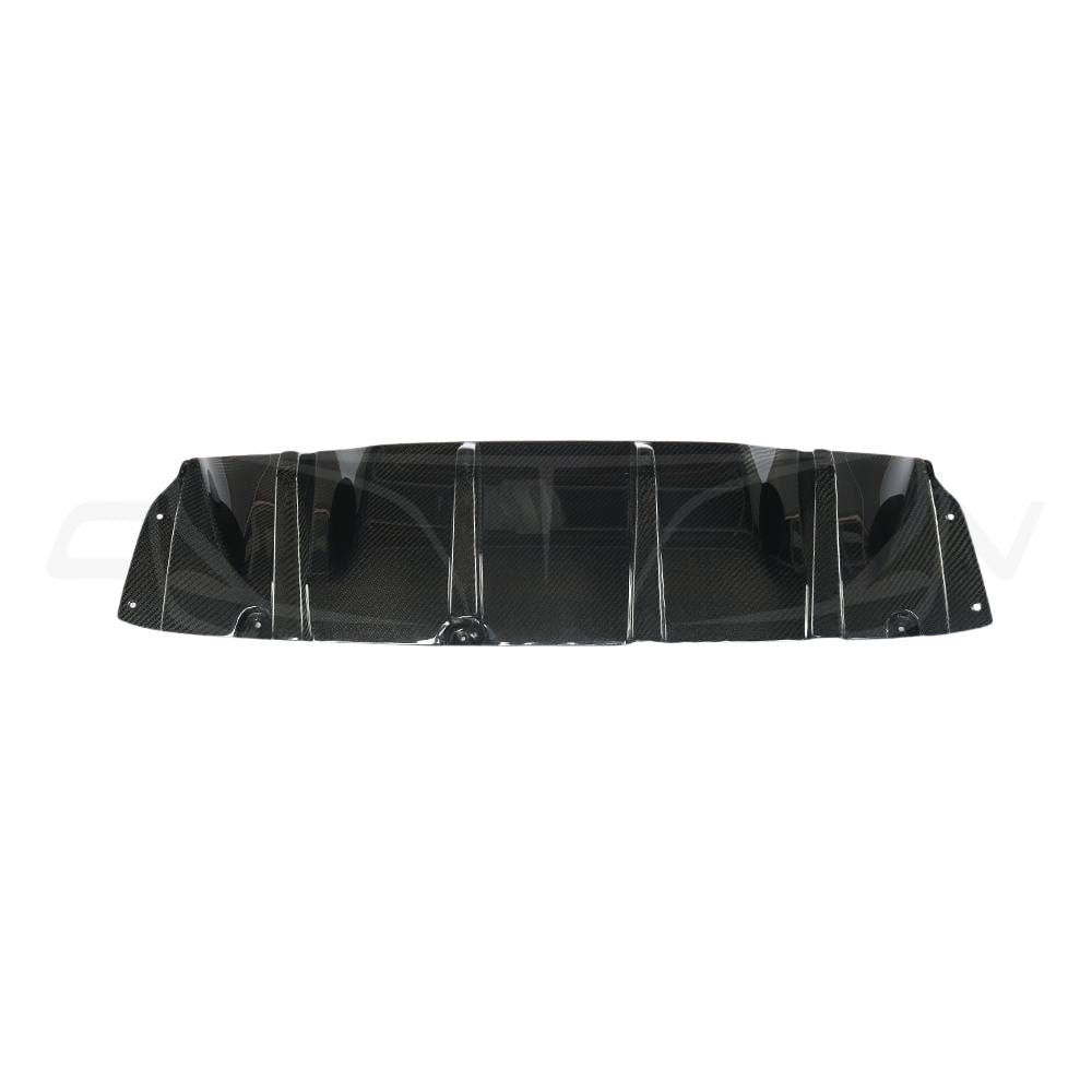 BMW M5 F90 carbon fibre diffuser by CT Carbon, V1, showcasing sleek, lightweight aerodynamic design with textured carbon fiber finish.